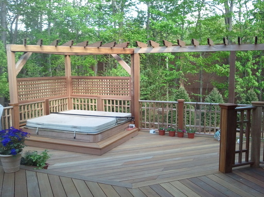 Custom mahogany deck with built in hottub.  Treliss, pergola and railings are all custom made.